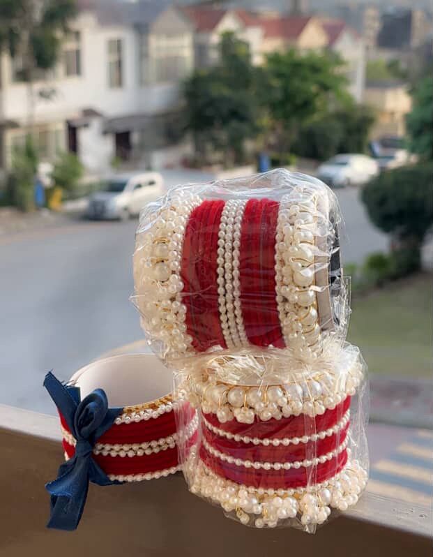Elegant Pearl Bangles Set with Golden Detailing & Navy Ribbon