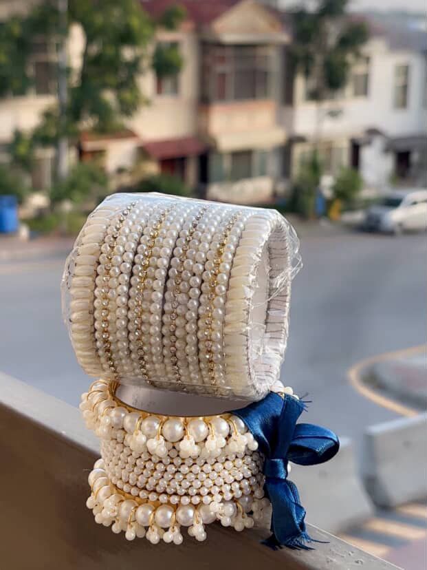 Elegant Pearl Bangles Set with Golden Detailing & Navy Ribbon